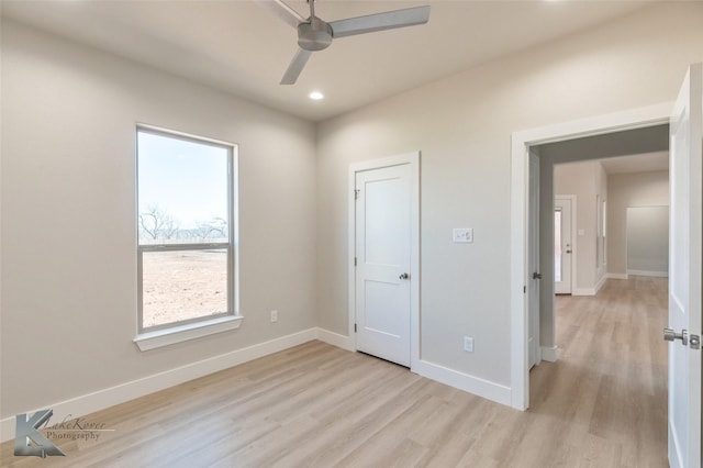 unfurnished bedroom featuring recessed lighting, ceiling fan, light wood-style flooring, and baseboards