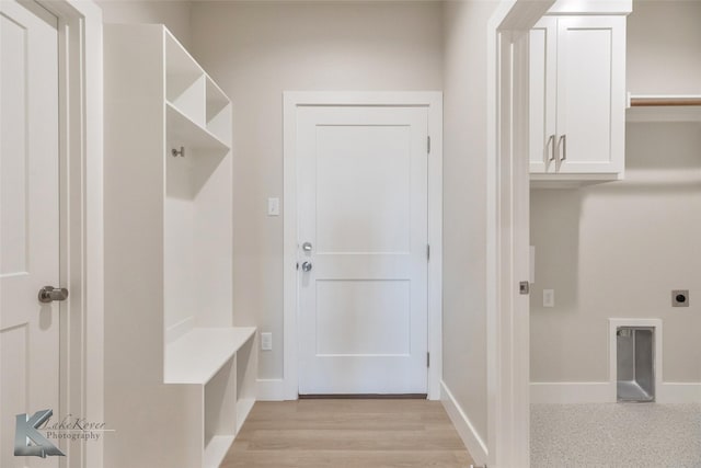 mudroom with light wood-style flooring and baseboards