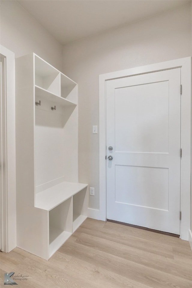 mudroom with light wood-style flooring