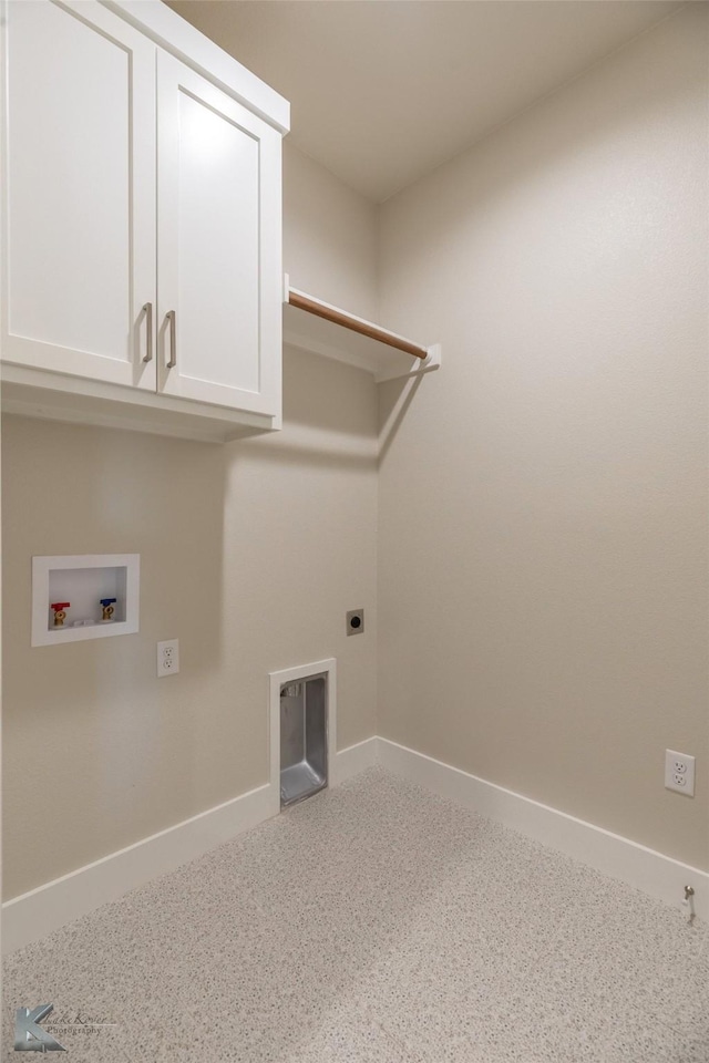 clothes washing area with washer hookup, cabinet space, hookup for an electric dryer, and baseboards