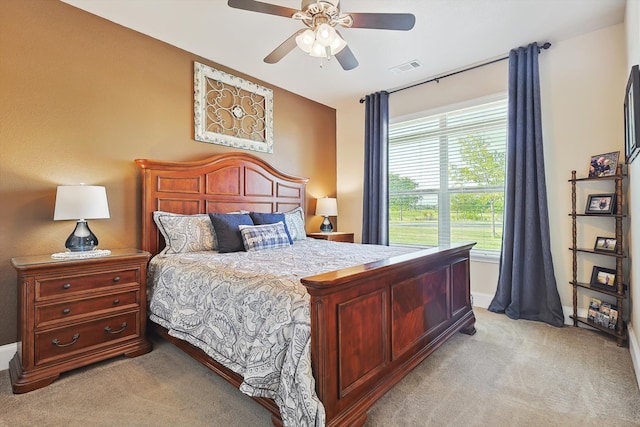 carpeted bedroom with ceiling fan