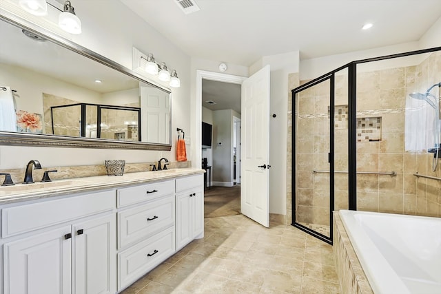 bathroom featuring vanity, tile patterned floors, and plus walk in shower