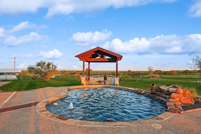 view of pool featuring a lawn