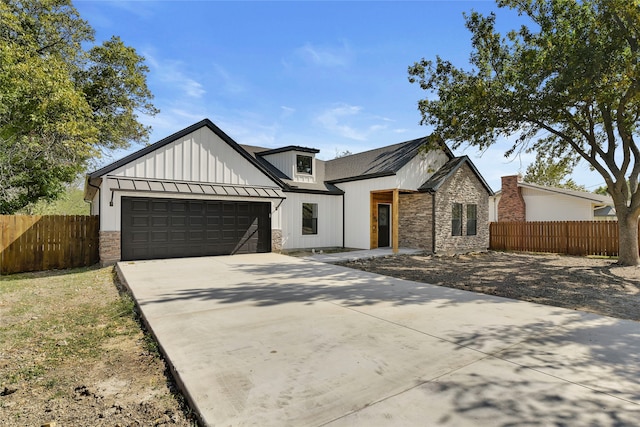 modern inspired farmhouse featuring a garage