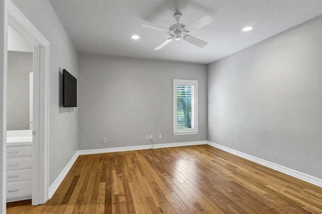 interior space featuring wood-type flooring and ceiling fan