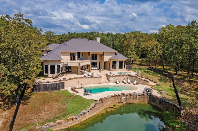 back of property featuring a yard and a patio area