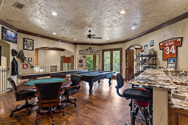 recreation room featuring crown molding, dark hardwood / wood-style floors, pool table, and ceiling fan