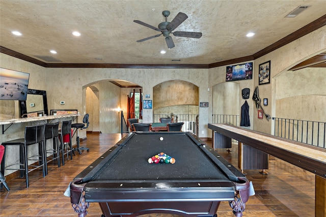 game room with ceiling fan, pool table, ornamental molding, and dark hardwood / wood-style flooring