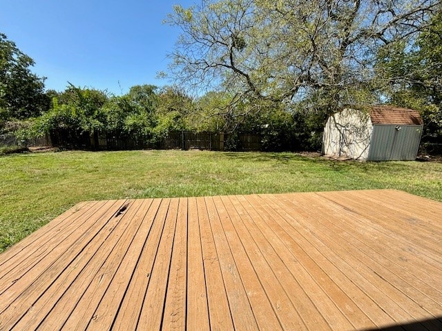 deck featuring a yard and a shed