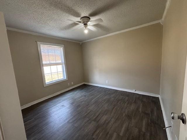 empty room featuring dark wood-style floors, ornamental molding, baseboards, and a ceiling fan