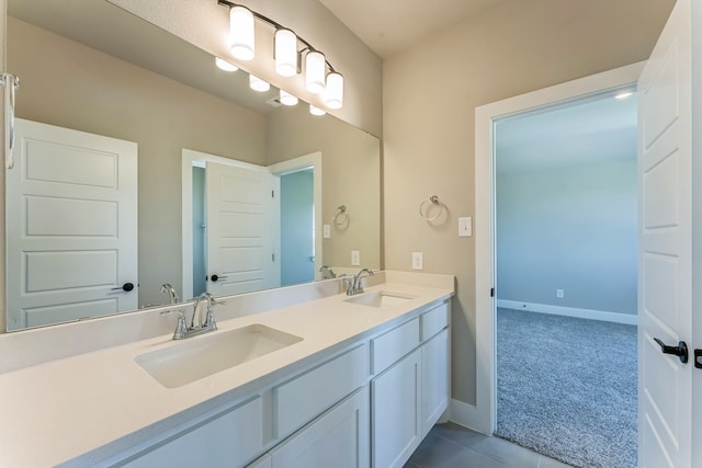 bathroom with tile patterned floors and vanity