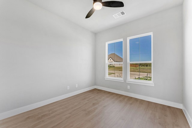 unfurnished room with ceiling fan and light hardwood / wood-style flooring