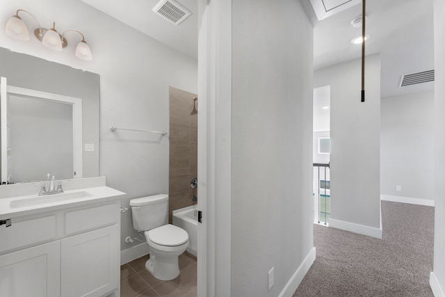 full bathroom with tile patterned floors, vanity, tiled shower / bath combo, and toilet