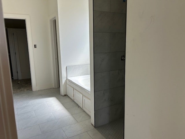 bathroom featuring plus walk in shower and tile patterned flooring