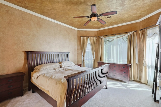 bedroom featuring crown molding, ceiling fan, and light colored carpet