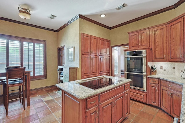 kitchen with stainless steel double oven, crown molding, and black electric cooktop