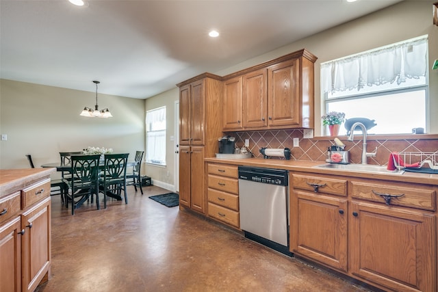 kitchen with dishwasher, decorative light fixtures, decorative backsplash, and a healthy amount of sunlight