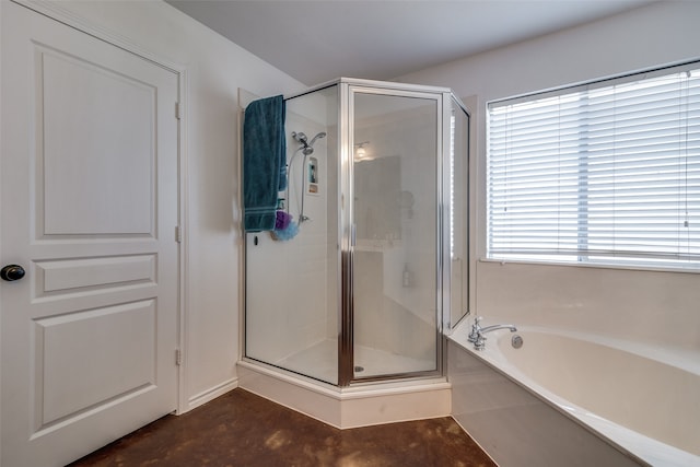 bathroom featuring concrete flooring and separate shower and tub