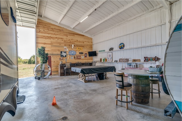 garage featuring wood walls