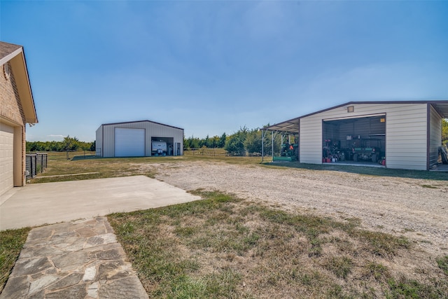 view of yard with an outdoor structure and a garage