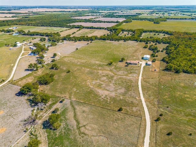 birds eye view of property featuring a rural view