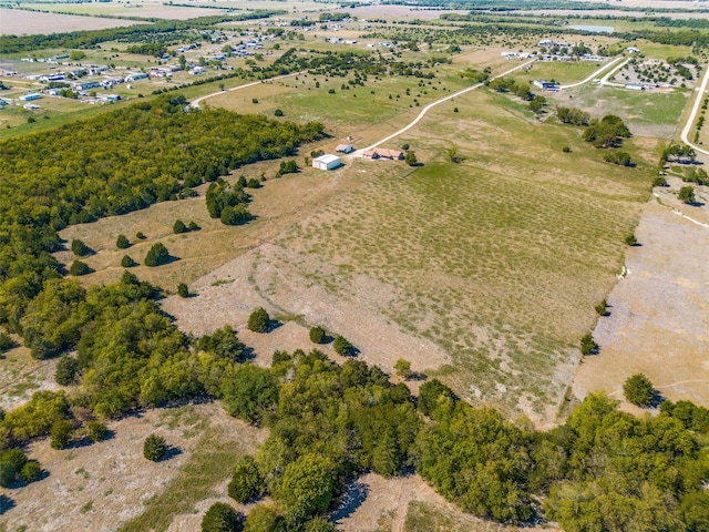 birds eye view of property with a rural view