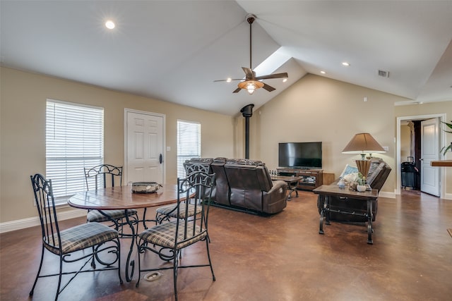 dining area with ceiling fan, plenty of natural light, and vaulted ceiling