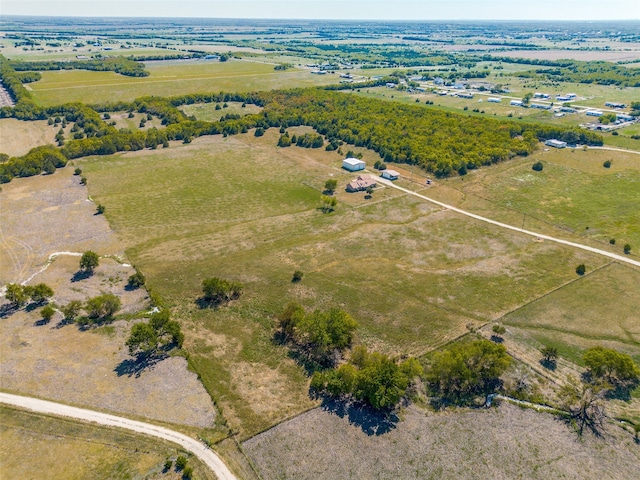 birds eye view of property with a rural view