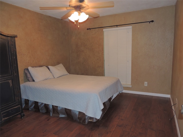 bedroom featuring ceiling fan and dark hardwood / wood-style flooring