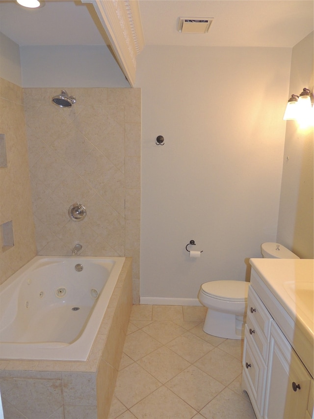 bathroom with vanity, toilet, and tile patterned floors