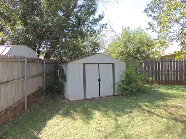 view of outdoor structure featuring a lawn