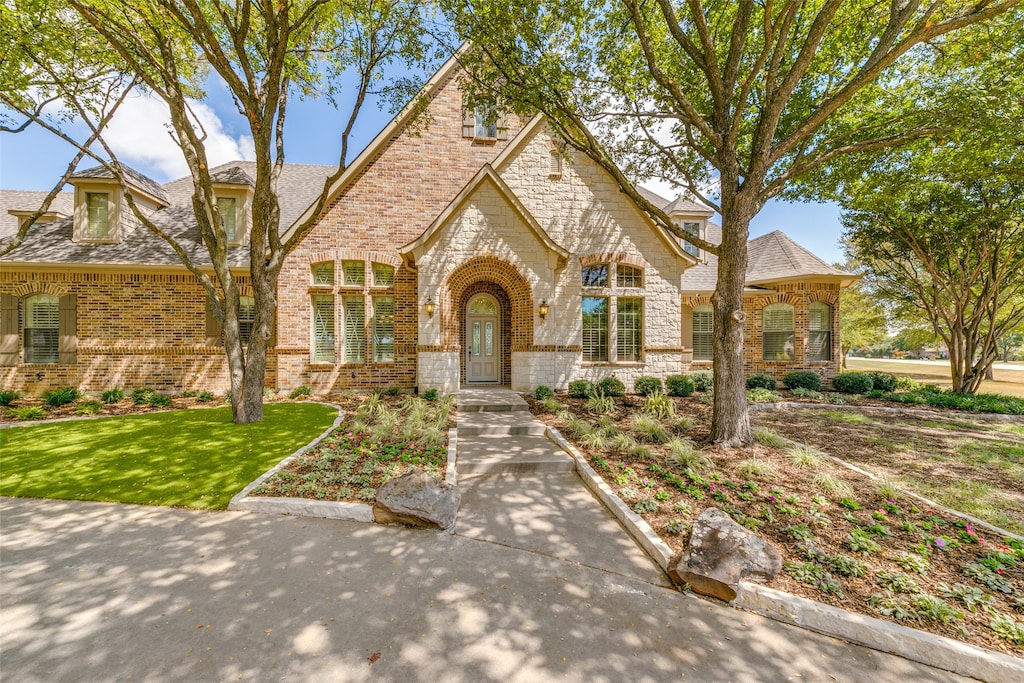 tudor home featuring a front yard