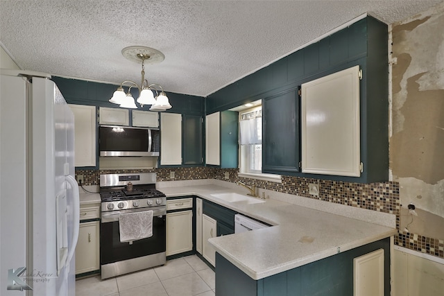 kitchen with light tile patterned flooring, stainless steel appliances, decorative light fixtures, sink, and a notable chandelier