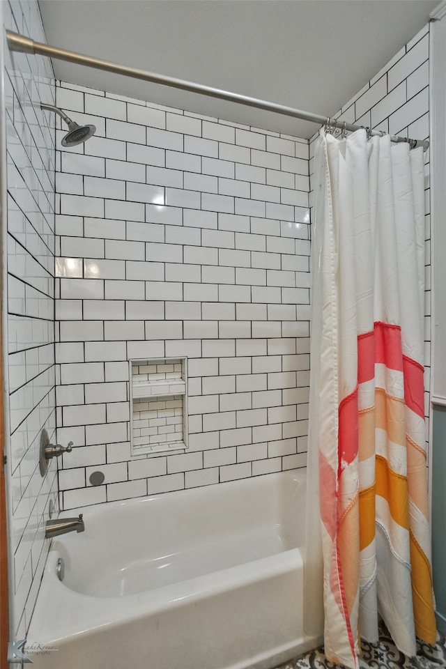 bathroom featuring shower / tub combo with curtain