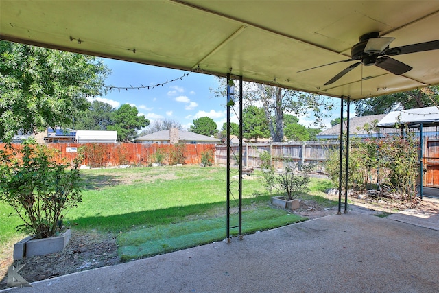 exterior space with ceiling fan and a patio area