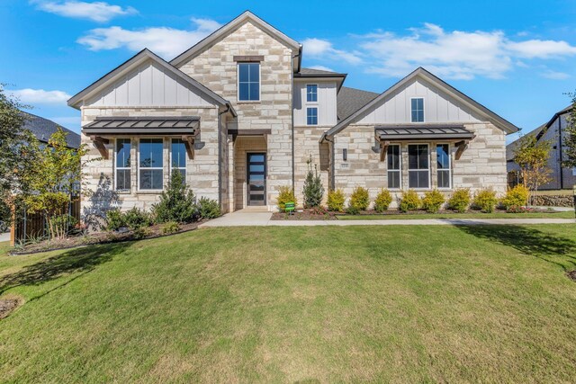 view of front of property with a lawn