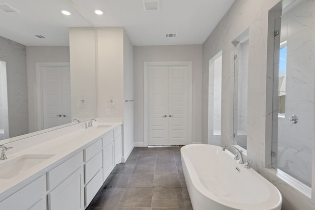 bathroom featuring vanity and shower with separate bathtub