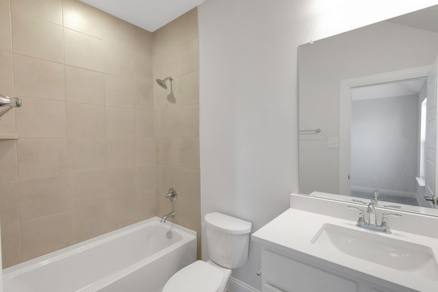 full bathroom featuring vanity, toilet, and tiled shower / bath