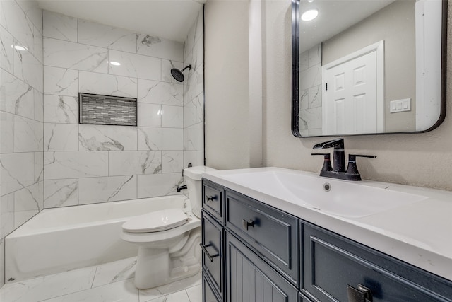 full bathroom featuring tiled shower / bath, vanity, and toilet