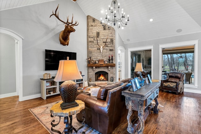 1552 Laguna Bay N, Pelican Bay, TX 76020 - living room featuring wood finished floors, a chandelier, arched walkways, baseboards, and wooden ceiling