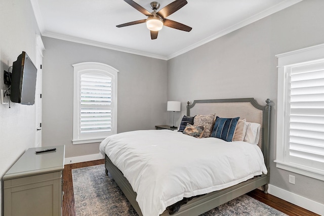 bedroom with ceiling fan, dark hardwood / wood-style floors, and ornamental molding