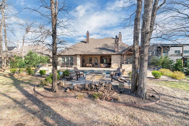 back of house with a patio area