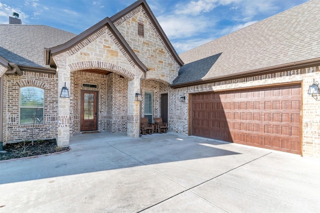 french country home with a garage