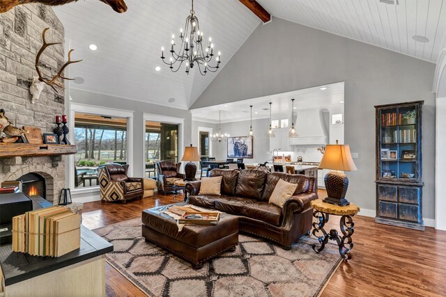 1552 Laguna Bay N, Pelican Bay, TX 76020 - living room featuring a chandelier, high vaulted ceiling, wood finished floors, a stone fireplace, and beamed ceiling