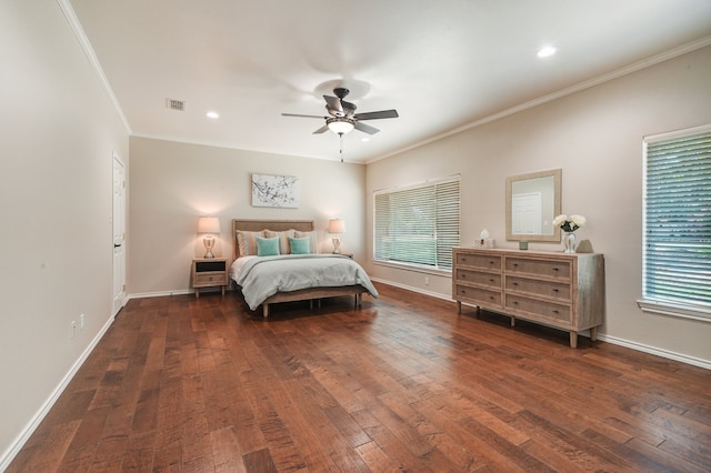 bedroom with dark hardwood / wood-style flooring, ceiling fan, and crown molding