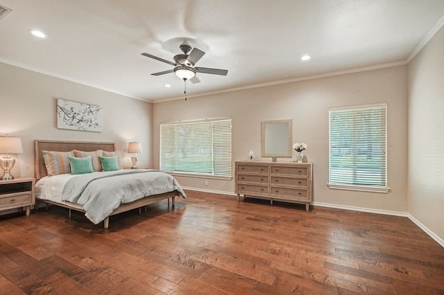 bedroom featuring ceiling fan, dark hardwood / wood-style flooring, and ornamental molding