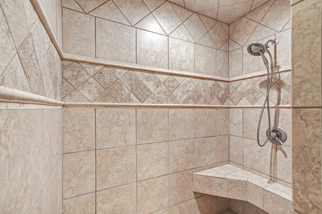 bathroom with a tile shower