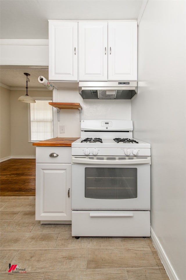 kitchen with light wood-type flooring, white cabinetry, hanging light fixtures, and white range with gas cooktop