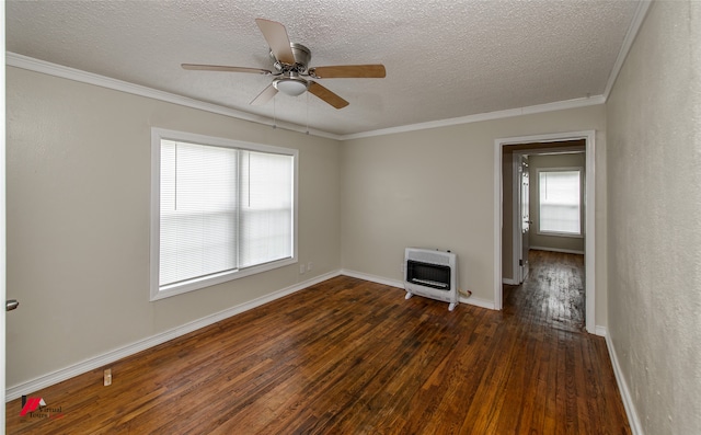 spare room featuring ceiling fan, dark hardwood / wood-style floors, and a healthy amount of sunlight