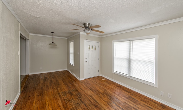 foyer entrance with a textured ceiling, ceiling fan, crown molding, and dark hardwood / wood-style flooring